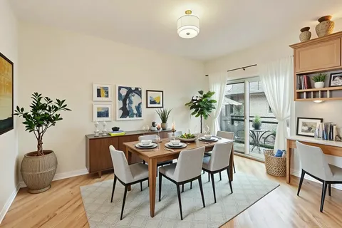 a view of a livingroom with furniture and a potted plant