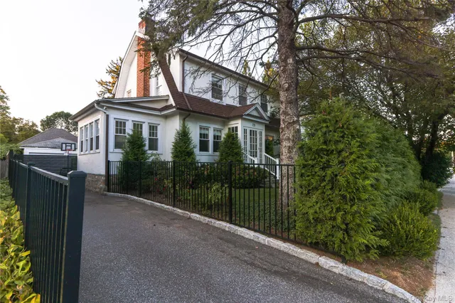 a view of a house with a small yard