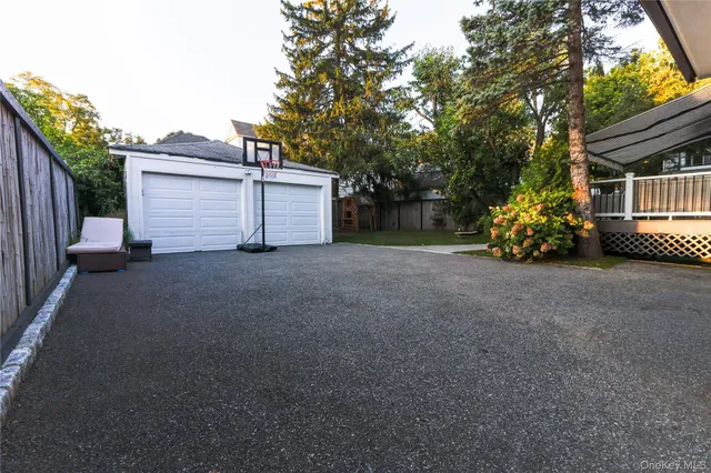 a view of a house with a garden and pathway