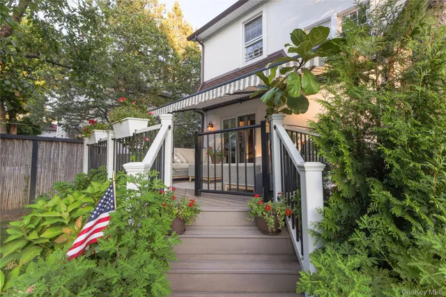 a view of a pathway of the house with flower plants