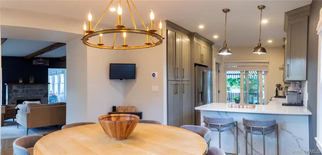a kitchen with a table and chairs in it