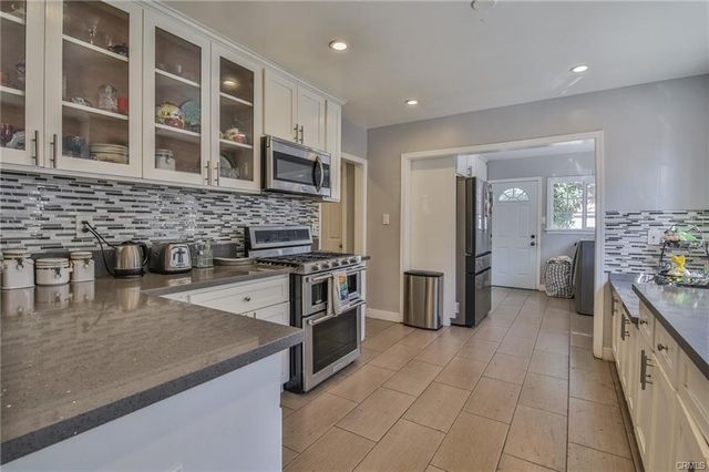 a view of a living room and chandelier