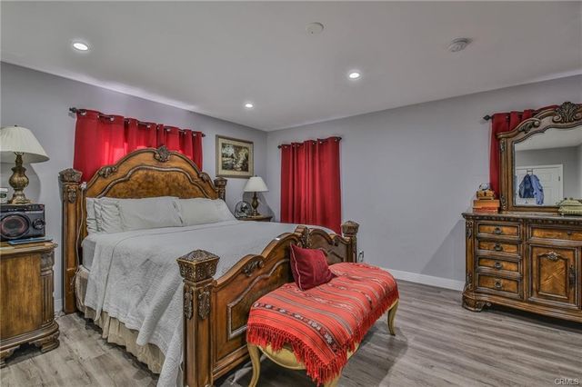 a bathroom with double vanity and a mirror