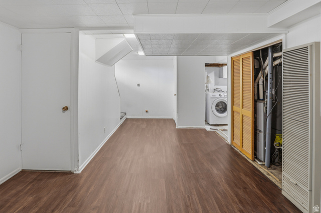 774 37th Street South Ogden, UT 84403 - Photo 47 of 47 Open floor plan featuring wood-finish flooring, white walls, and a recessed laundry area with a visible washer