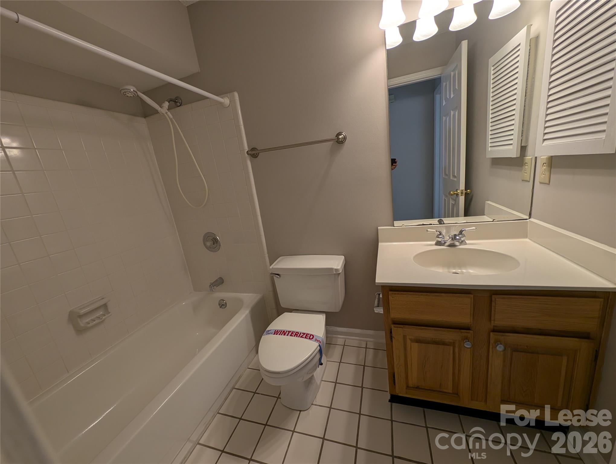 5001 Sharon Road, Unit K Charlotte, NC 28210 - Photo 15 of 24 a bathroom with a sink toilet and shower