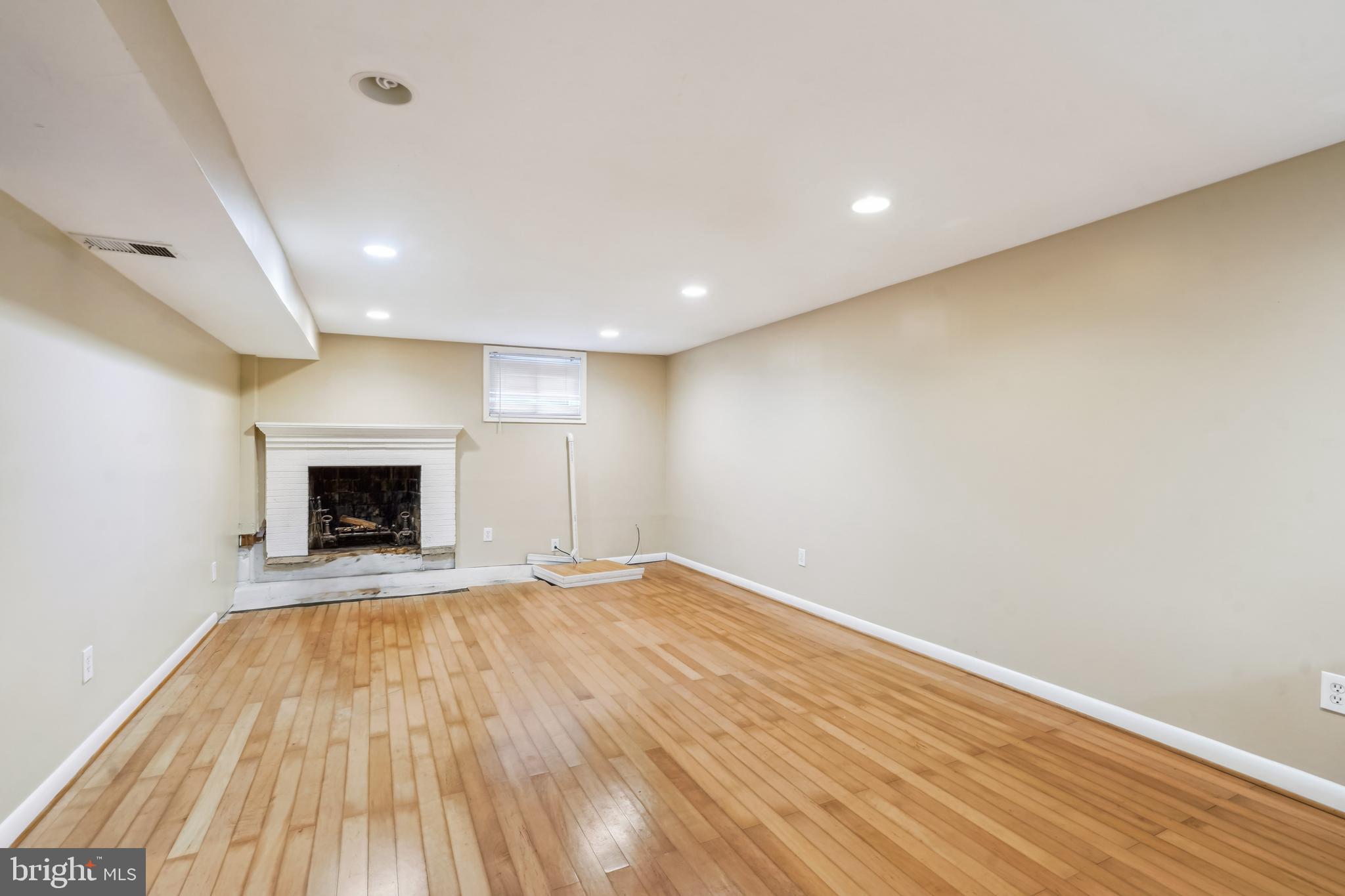 11114 Schuylkill Road Rockville, MD 20852 - Photo 24 of 38 Lower level rec room w/ wood fireplace