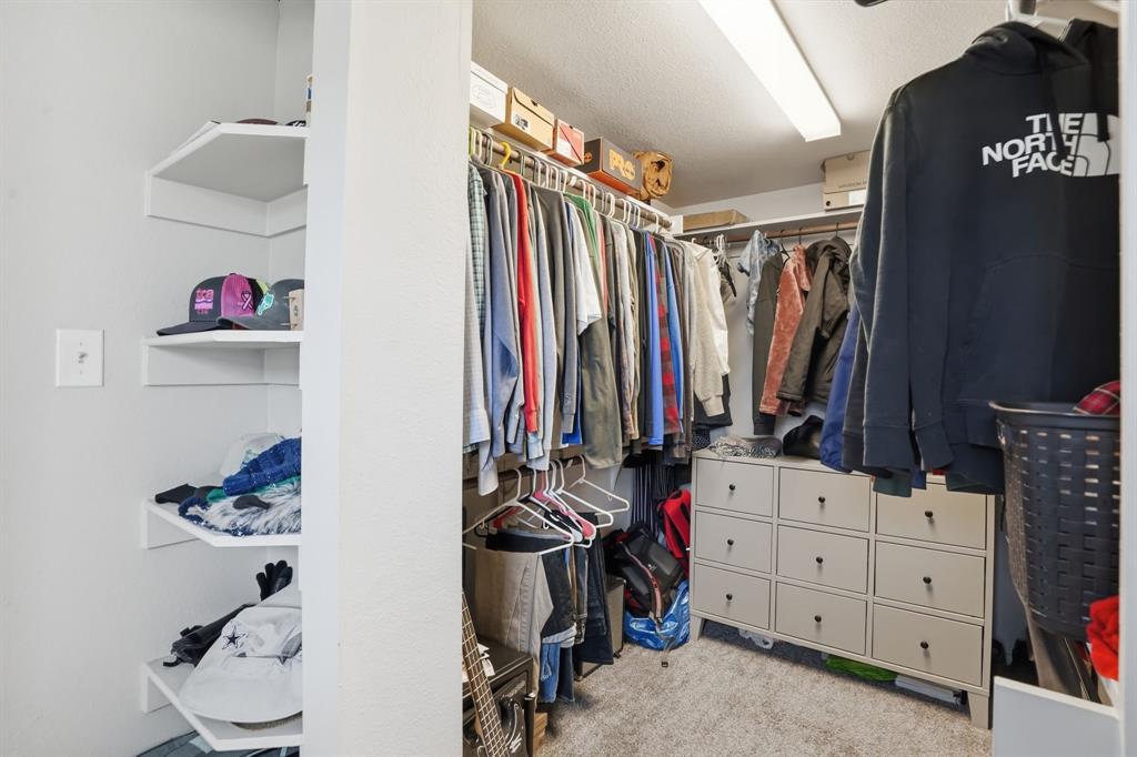 7701 John T White Road Fort Worth, TX 76120 - Photo 17 of 23 a view of a closet with storage