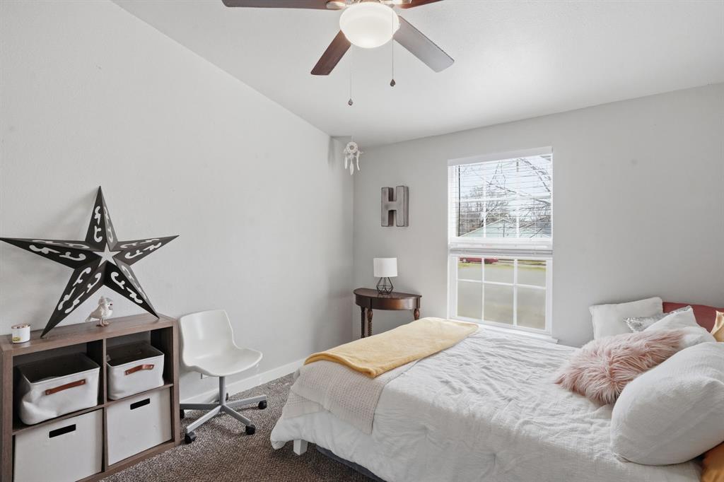 7701 John T White Road Fort Worth, TX 76120 - Photo 19 of 23 a bedroom with a bed and a window
