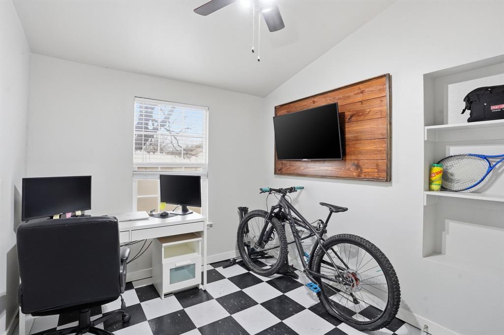 7701 John T White Road Fort Worth, TX 76120 - Photo 20 of 23 a view of a workspace with furniture and a flat screen tv
