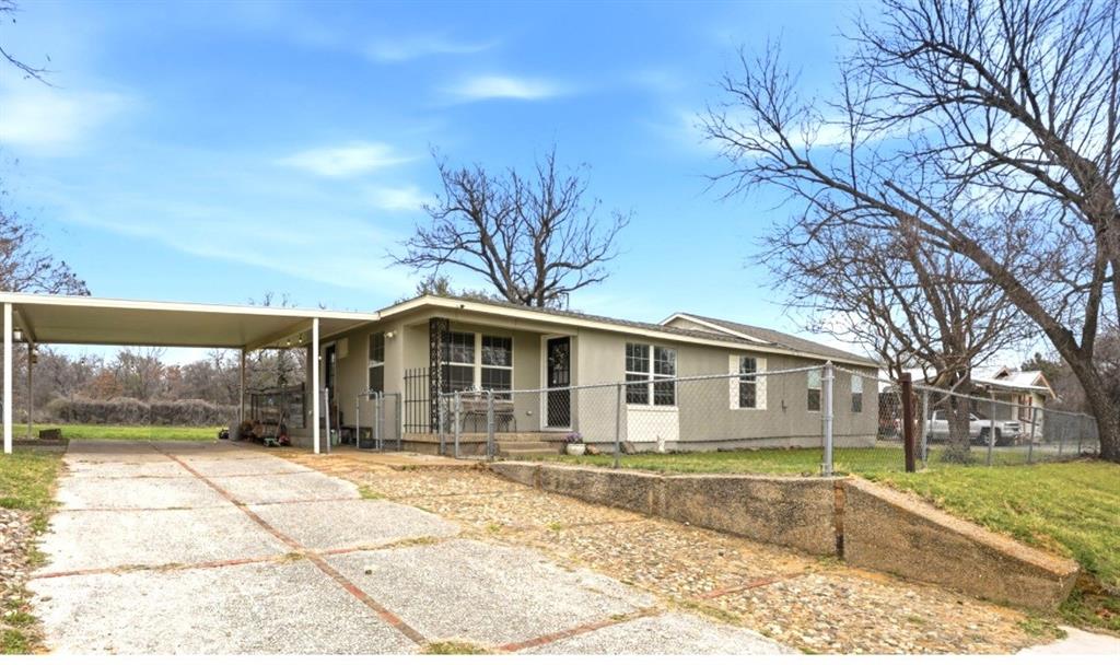 7701 John T White Road Fort Worth, TX 76120 - Photo 2 of 23 a front view of a house with a yard