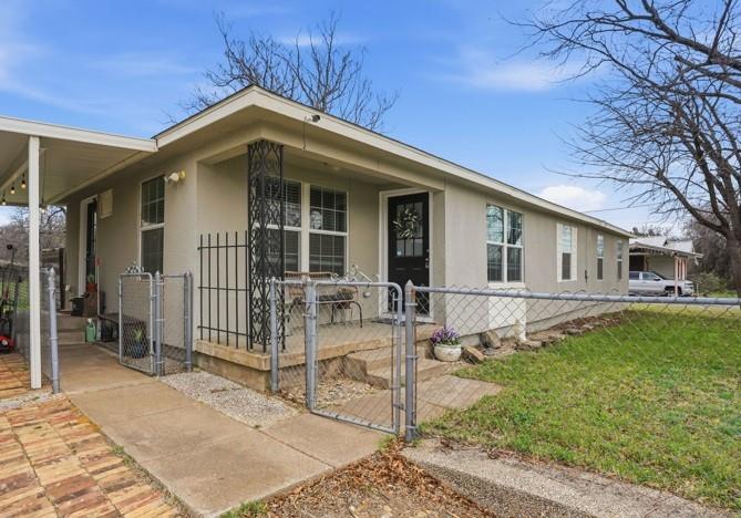 7701 John T White Road Fort Worth, TX 76120 - Photo 3 of 23 a front view of a house with a yard