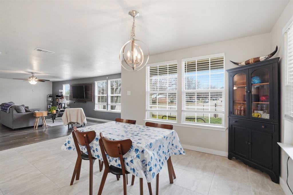 7701 John T White Road Fort Worth, TX 76120 - Photo 8 of 23 a view of a dining room with furniture window and outside view