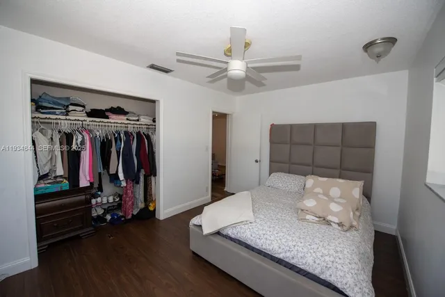 a living room with hard wood flooring and a couch