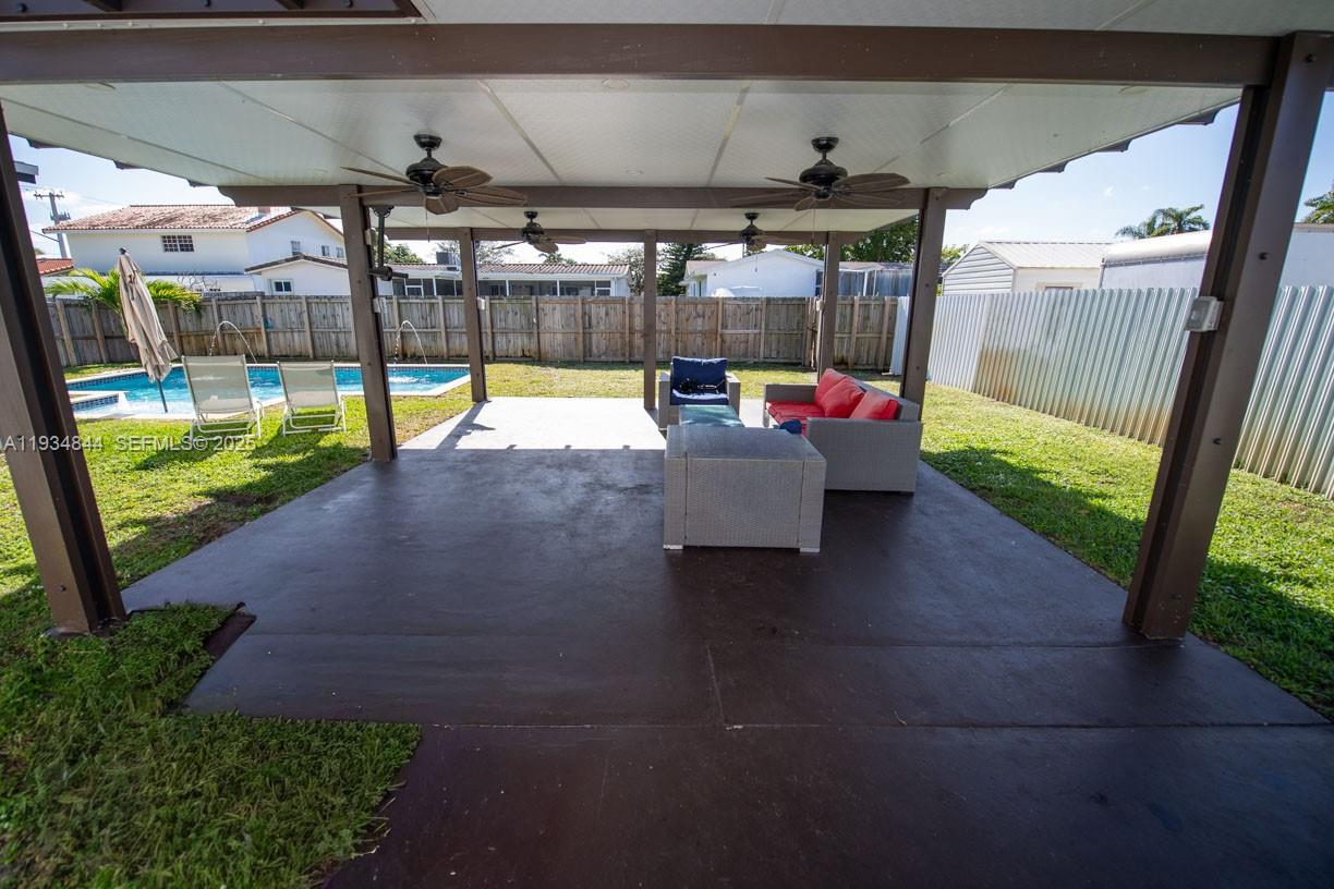 5012 Taft Street Hollywood, FL 33021 - Photo 26 of 36 a view of a swimming pool with a porch