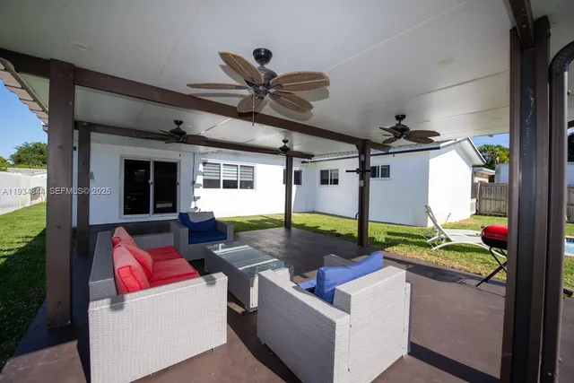 a view of a house with backyard and porch