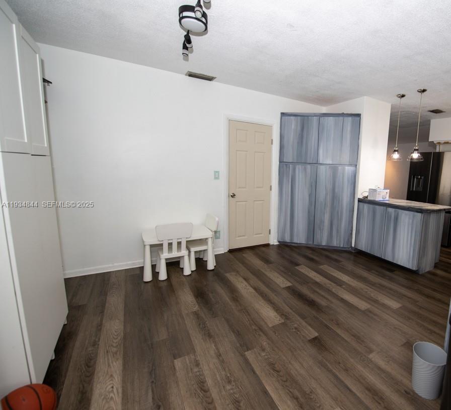 5012 Taft Street Hollywood, FL 33021 - Photo 10 of 36 a view of a livingroom with furniture wooden floor and staircase