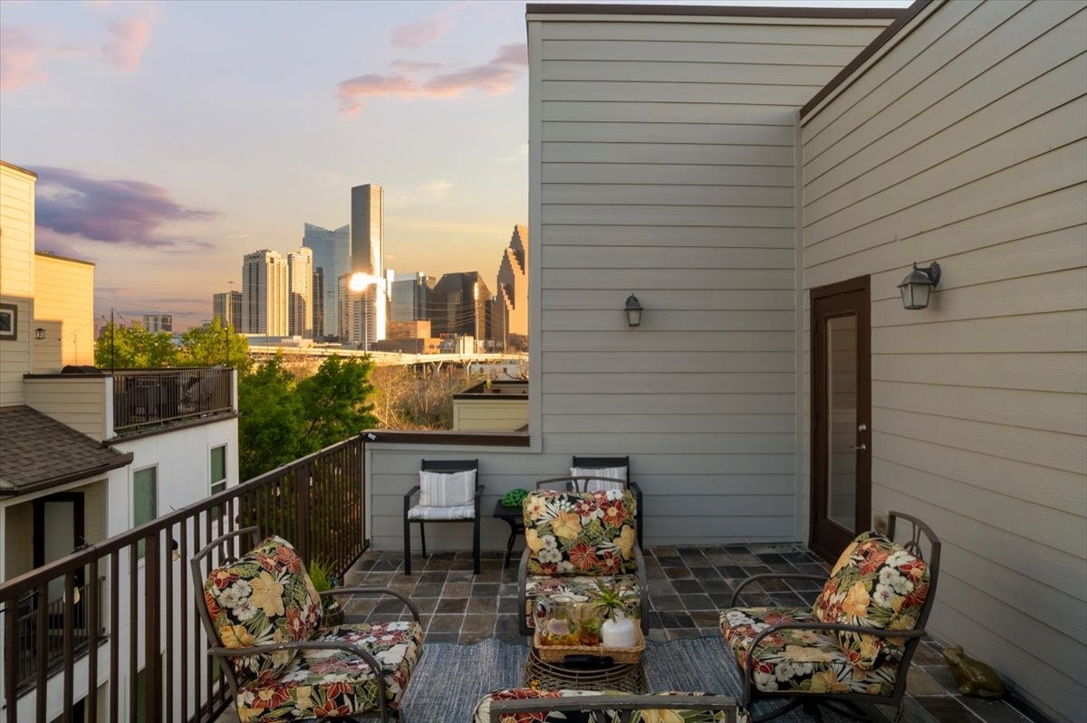 1005 Bingham Street, Unit 5 Houston, TX 77007 - Photo 18 of 50 This rooftop terrace features a cozy seating area and breathtaking views of the city skyline, creating the perfect setting for relaxing or entertaining guests.