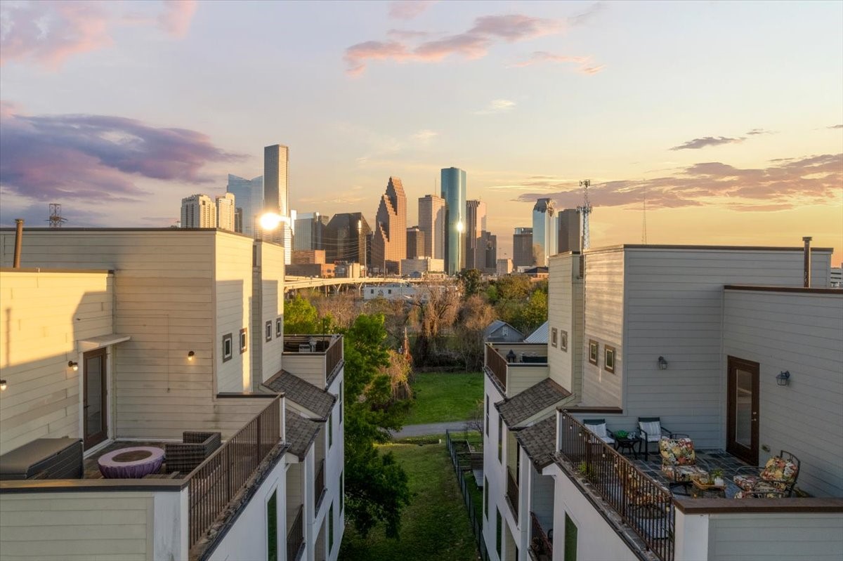 1005 Bingham Street, Unit 5 Houston, TX 77007 - Photo 21 of 50 This modern home features rooftop terrace with stunning sunset views of the city skyline, offering a perfect blend of urban living and scenic beauty.