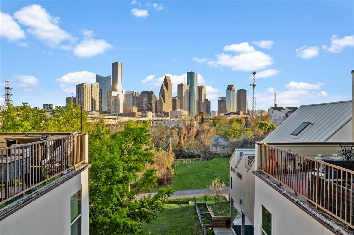 1005 Bingham Street, Unit 5 Houston, TX 77007 - Photo 27 of 50 This photo showcases a stunning view of a city skyline. The area is surrounded by greenery, offering a blend of urban and natural scenery.