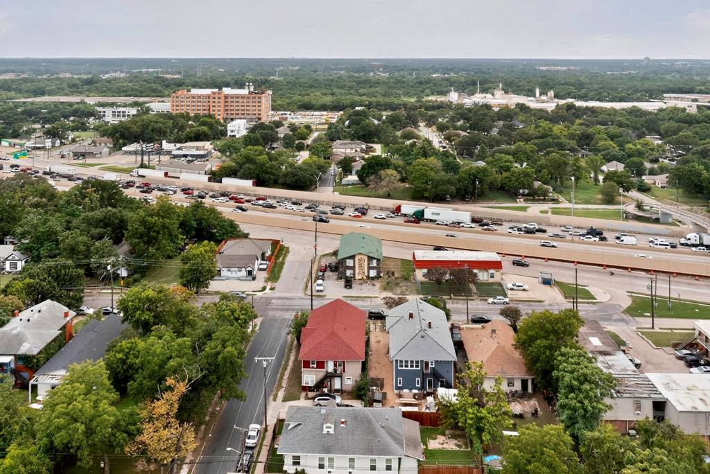3525 Colonial Avenue Dallas, TX 75215 - Photo 18 of 24 Aerial perspective of suburban area with a tree filled landscape