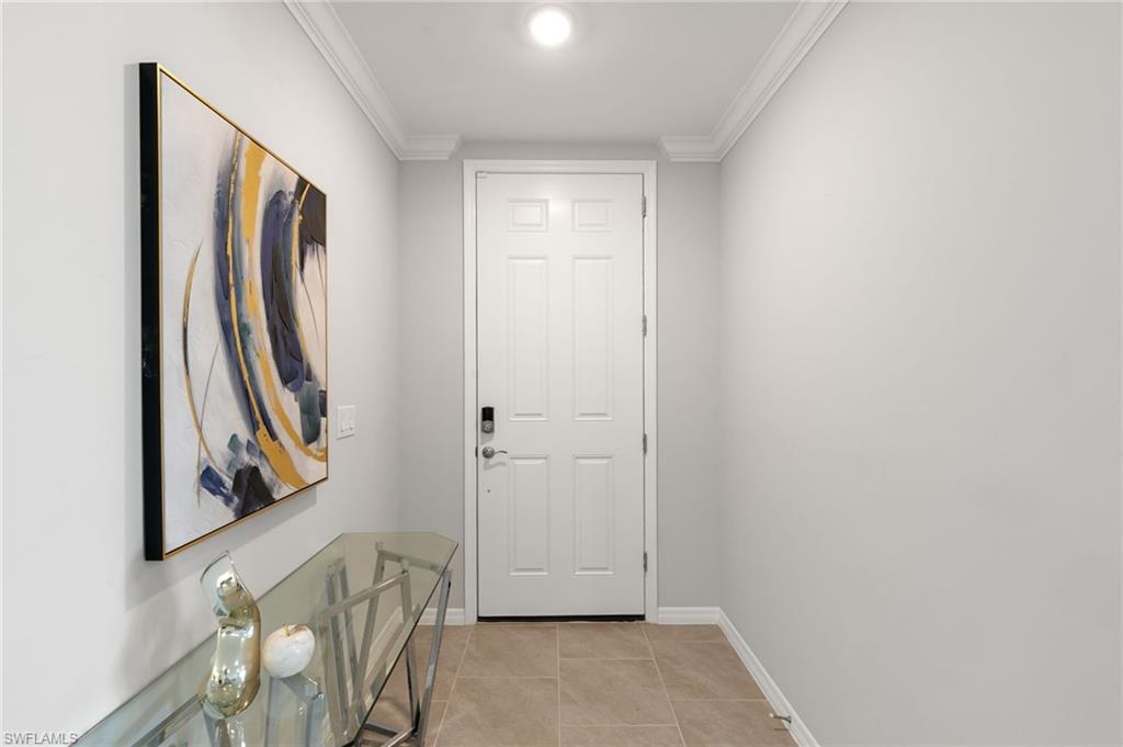 14618 Edgewater Circle Naples, FL 34114 - Photo 3 of 47 a view of front door with furniture