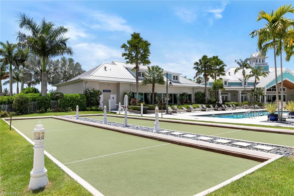 14618 Edgewater Circle Naples, FL 34114 - Photo 43 of 47 a view of a swimming pool and lounge chairs
