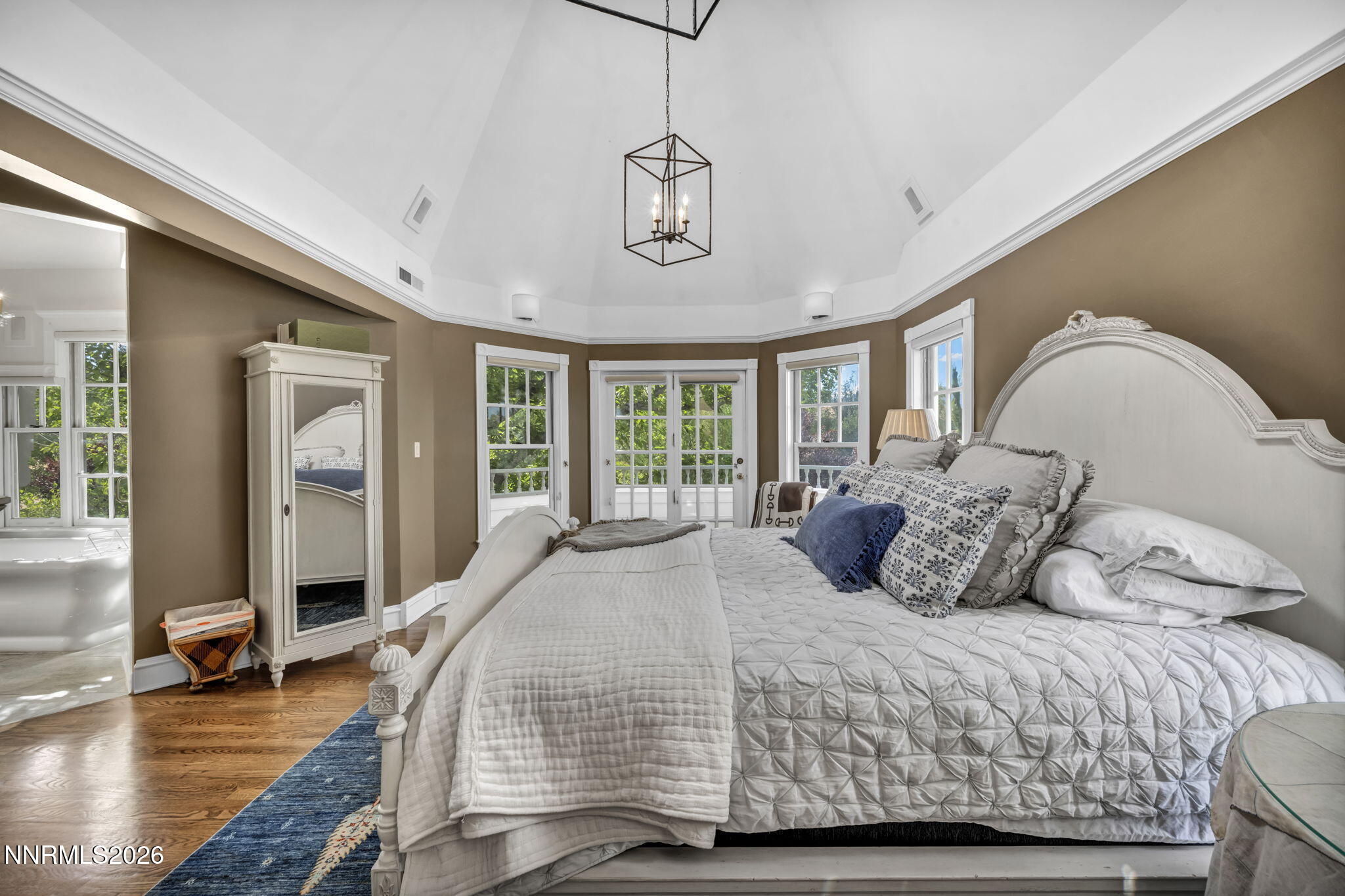 4010 Canyon Drive Reno, NV 89519 - Photo 50 of 147 a bedroom with a large bed and wooden floor