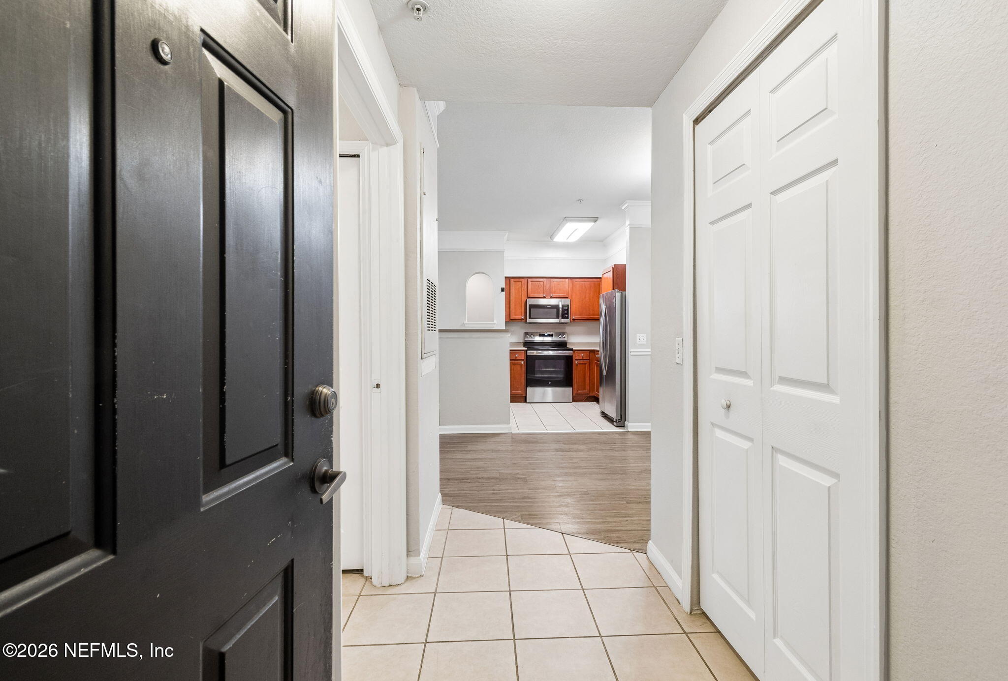 8550 Touchton Road, Unit 511 Jacksonville, FL 32216 - Photo 20 of 63 a view of a hallway with wooden cabinets