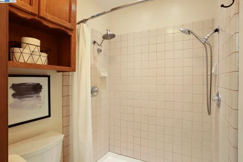 a bathroom with a shower and a sink