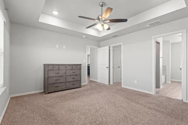 a bathroom with a bathtub a sink and a mirror