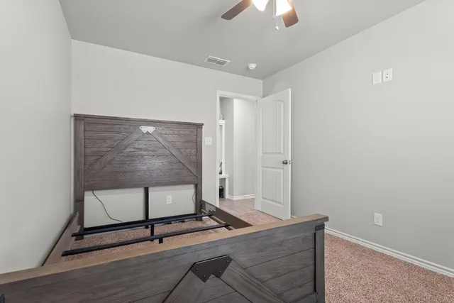 a kitchen with a refrigerator and a sink