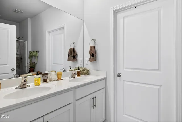 a bathroom with a shower and a shower