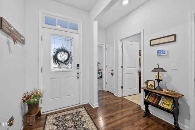 a open kitchen with stainless steel appliances granite countertop a lot of cabinets and wooden floor