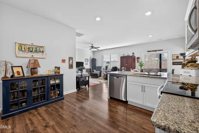 a living room with furniture and a lamp