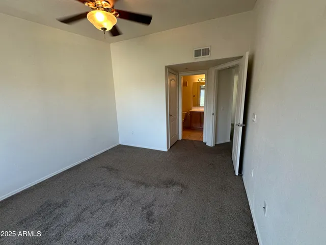 a white toilet and tub sitting next to a bathroom sink