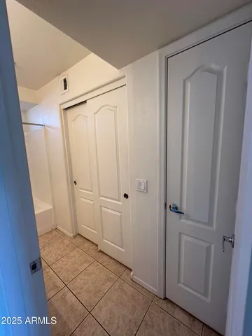 a front view of building with a garden