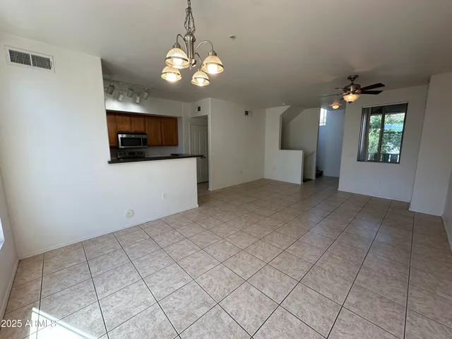 a view of a kitchen with furniture and cabinets