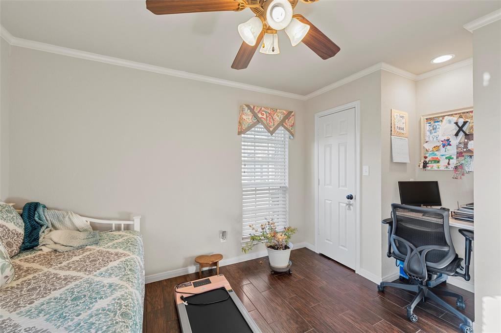 142 Phillip Circle Hewitt, TX 76643 - Photo 19 of 24 Bedroom featuring ornamental molding, a desk, dark wood-type flooring, and ceiling fan