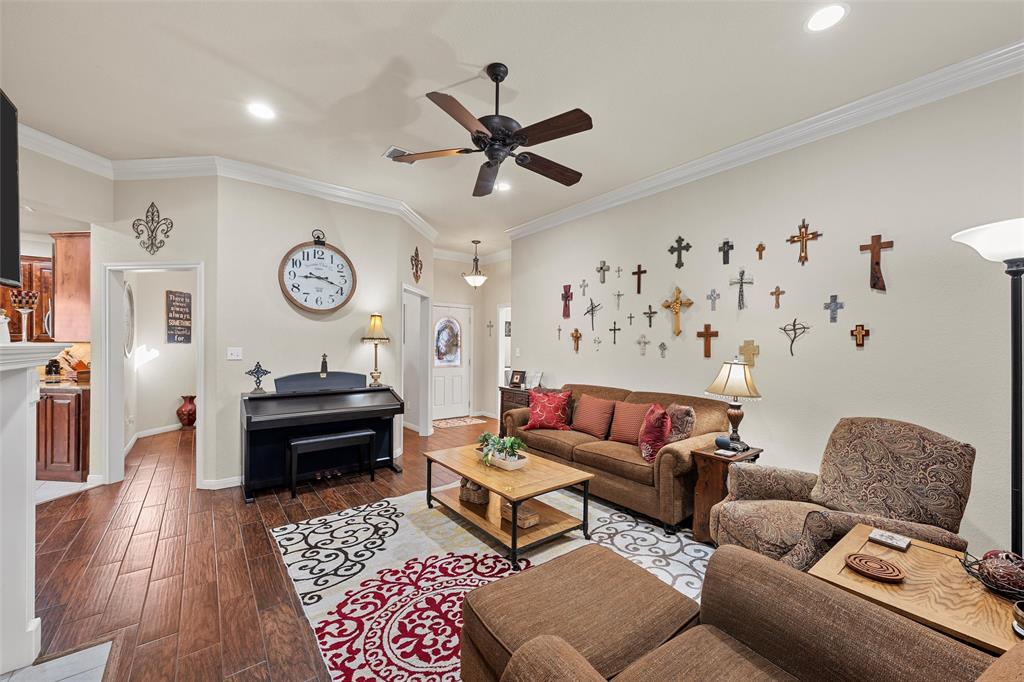 142 Phillip Circle Hewitt, TX 76643 - Photo 5 of 24 Living area featuring wood finished floors, a ceiling fan, ornamental molding, and recessed lighting