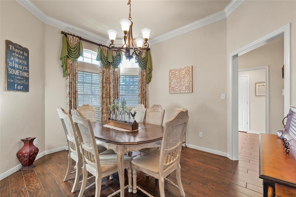 142 Phillip Circle Hewitt, TX 76643 - Photo 6 of 24 Dining room featuring a chandelier, dark wood-type flooring, and crown molding