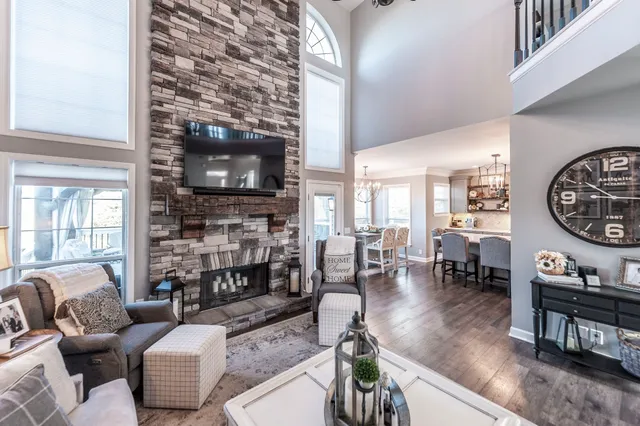 a living room with fireplace furniture and a flat screen tv