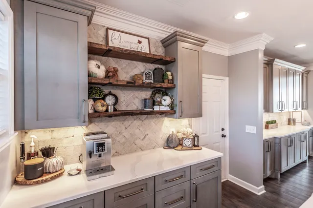 a kitchen with cabinets and window