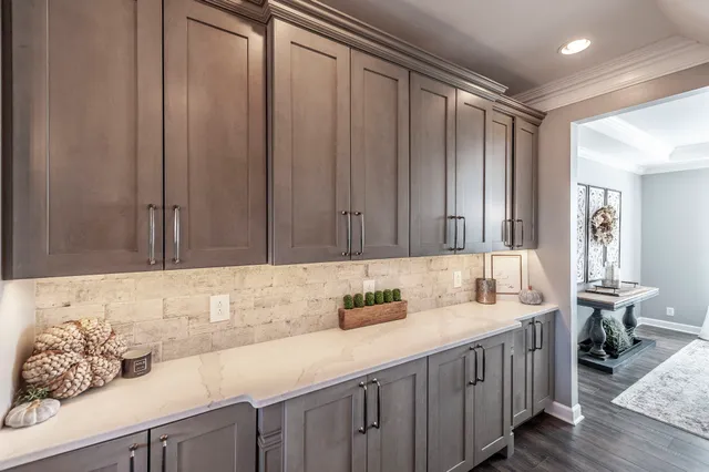 a kitchen with a sink and cabinets
