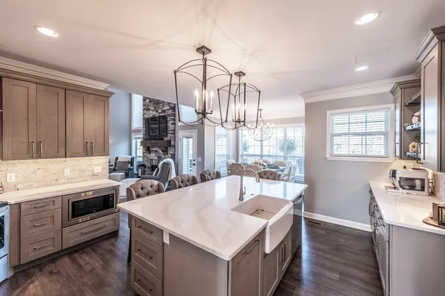 a kitchen with a stove a sink and a refrigerator