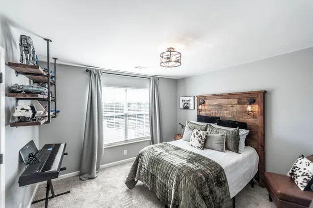 a bedroom with a bed and cabinets