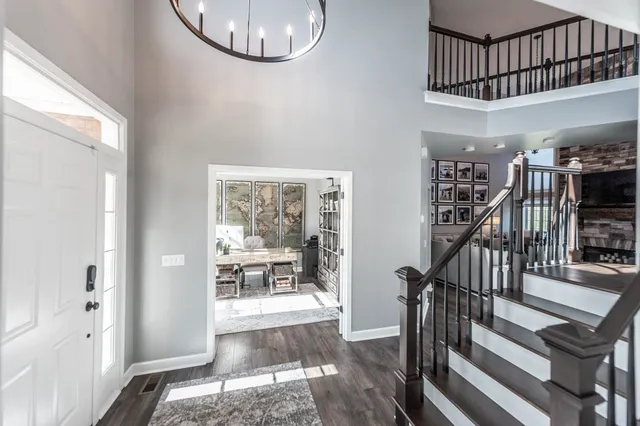 a view of staircase with white walls and a window