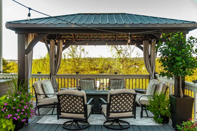 a view of roof deck with patio table and chairs