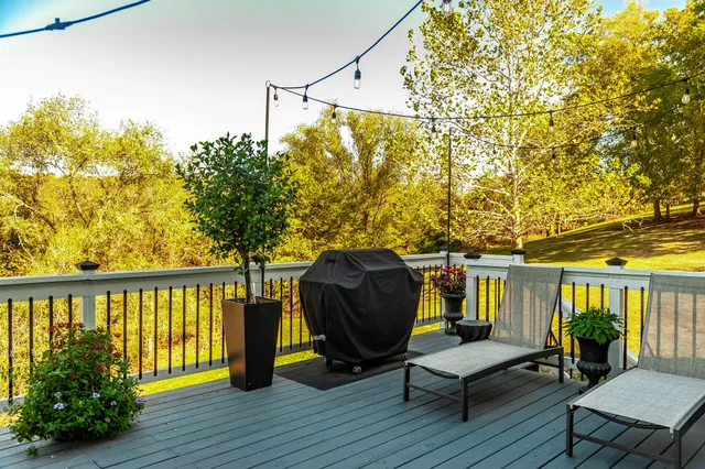 a view of a chairs and table in the balcony