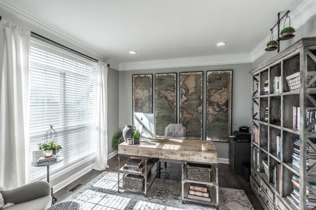 a workspace with furniture and a potted plant