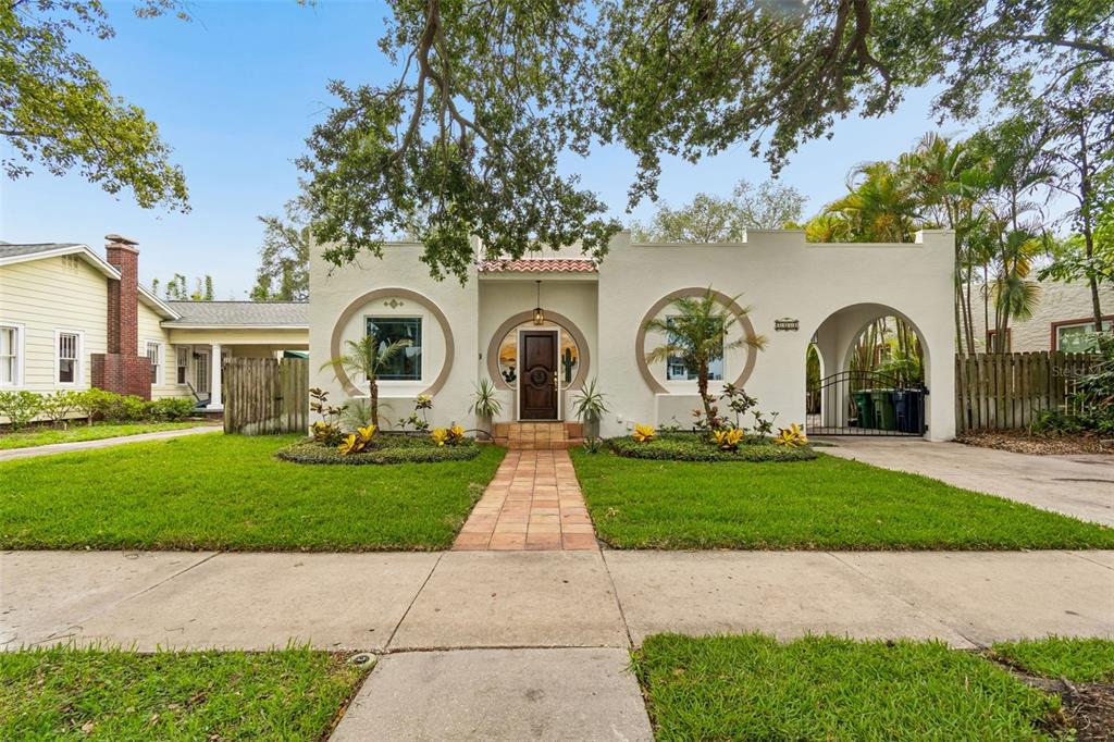 2434 West Prospect Road Tampa, FL 33629 - Photo 1 of 45 a front view of a house with garden